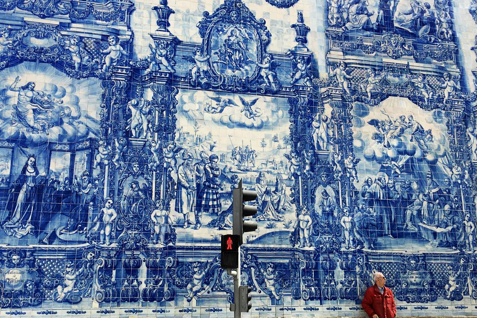 Blue-and-white Portuguese azulejo tile mural depicting historic scenes